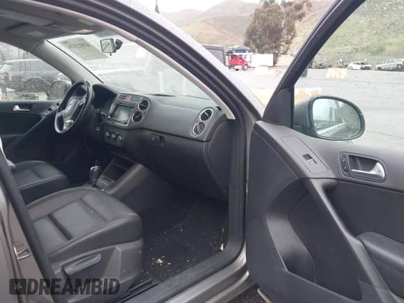 2011 Volkswagen Tiguan SE with VIN WVGAV7AX4BW515069, listed as a IAAI auction lot 41813579 with 100,644 mi miles and . Bid and sale history available at DreamBid. Image 5.