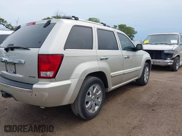 2009 Jeep Grand Cherokee with VIN 1J8HR68T59C520547, listed as a IAAI auction lot 42928715 with 168,824 mi miles and . Bid and sale history available at DreamBid. Image 4.