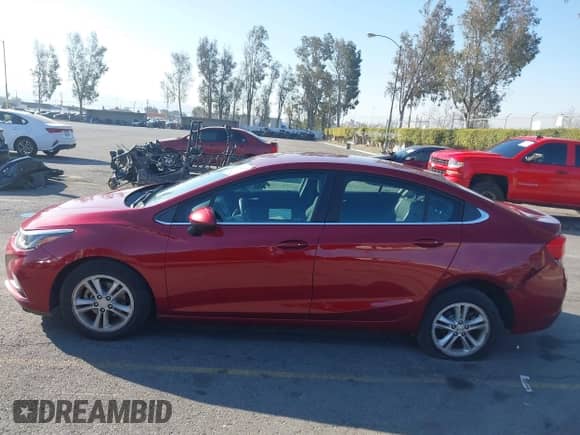 2018 Chevrolet Cruze LT with VIN 1G1BH5SE7J7189433, listed as a IAAI auction lot 41644135 with 141,714 mi miles and . Bid and sale history available at DreamBid. Image 14.