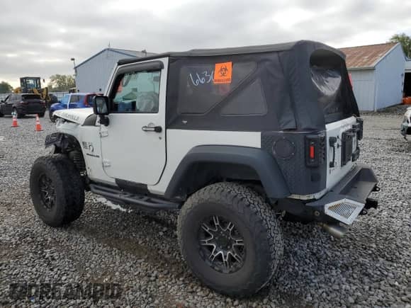 2015 Jeep Wrangler Willys Wheeler with VIN 1C4AJWAG0FL663091, listed as a Copart auction lot 81737785 with Not provided miles and Salvage title. Bid and sale history available at DreamBid. Image 2.