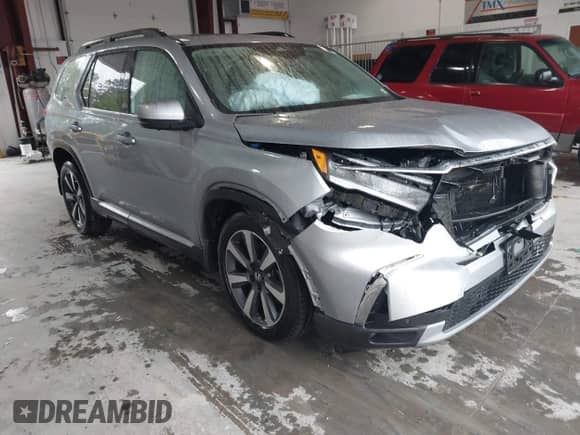 2023 Honda Pilot Elite z VIN 5FNYG1H88PB017705, wystawiony jako IAAI lot #42326303 z przebiegiem 23 725 mil mil oraz . Historia ofert i sprzedaży dostępna na DreamBid. Obrazek 1.