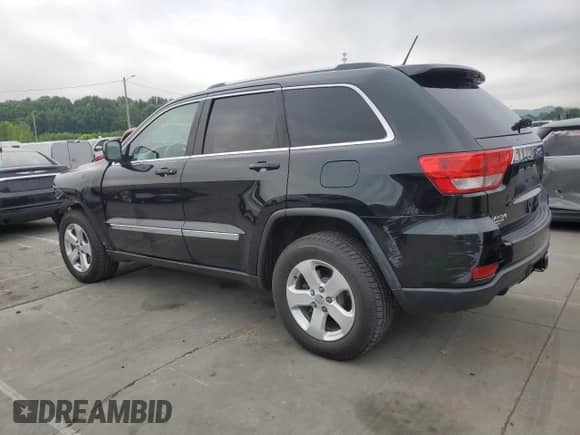 2012 Jeep Grand Cherokee Laredo с VIN 1C4RJEATXCC317054, выставлен на аукционе Copart как лот 63057615 с пробегом 159 633 миль миль и Списание • Salvage title. История ставок и продаж доступна на DreamBid. Изображение 2.