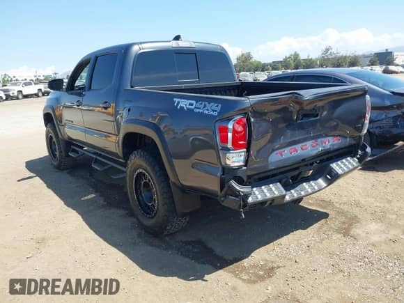 2021 Toyota Tacoma SR with VIN 3TMCZ5AN3MM450562, listed as a IAAI auction lot 43071461 with 15,850 mi miles and . Bid and sale history available at DreamBid. Image 3.