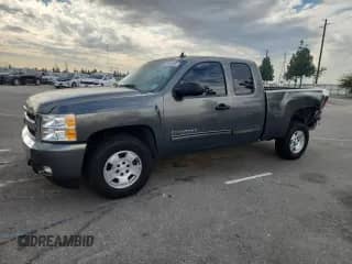2011 Chevrolet Silverado 1500 LT with VIN 1GCRCSE00BZ180758, listed as a Copart auction lot 82004455 with 183,435 mi miles and Salvage title. Bid and sale history available at DreamBid. Image 1.