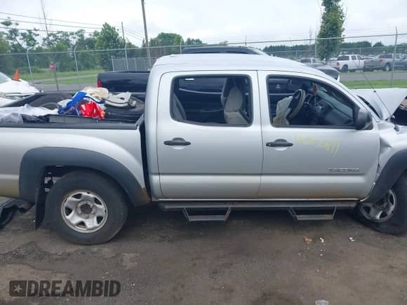 2009 Toyota Tacoma PreRunner z VIN 3TMJU62N99M077383, wystawiony jako IAAI lot #42670811 z przebiegiem 168 908 mil mil oraz . Historia ofert i sprzedaży dostępna na DreamBid. Obrazek 14.