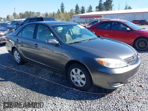 2003 Toyota Camry LE with VIN JTDBE32K530180767, listed as a IAAI auction lot 43276458 with 189,568 mi miles and . Bid and sale history available at DreamBid. Image 1.