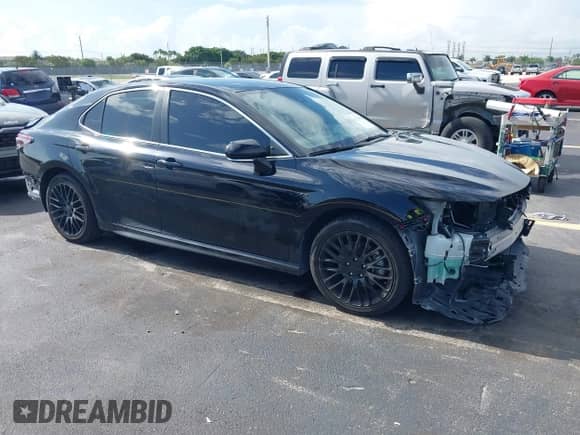 2023 Toyota Camry SE z VIN 4T1G11AK6PU774219, wystawiony jako IAAI lot #42733636 z przebiegiem 43 027 mil mil oraz . Historia ofert i sprzedaży dostępna na DreamBid. Obrazek 1.