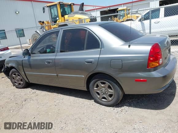 2005 Hyundai Accent GLS z VIN KMHCG45C55U608336, wystawiony jako IAAI lot #42743218 z przebiegiem 221 254 mil mil oraz . Historia ofert i sprzedaży dostępna na DreamBid. Obrazek 14.