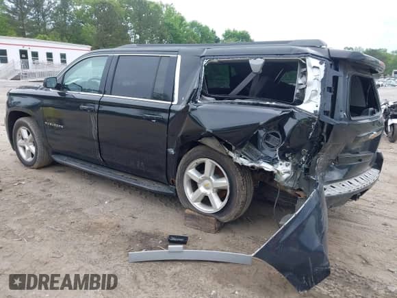 2015 Chevrolet Suburban with VIN 1GNSKHEC1FR207500, listed as a IAAI auction lot 42096645 with 188,187 mi miles and . Bid and sale history available at DreamBid. Image 3.