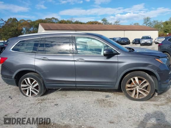 2018 Honda Pilot Elite z VIN 5FNYF6H06JB025867, wystawiony jako IAAI lot #43524597 z przebiegiem 94 479 mil mil oraz . Historia ofert i sprzedaży dostępna na DreamBid. Obrazek 13.