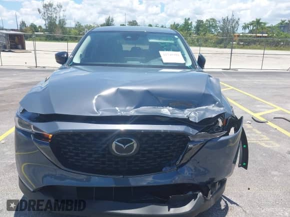 2023 Mazda CX-5 S Carbon Edition z VIN JM3KFBCM2P0200445, wystawiony jako IAAI lot #42745392 z przebiegiem 21 932 mil mil oraz . Historia ofert i sprzedaży dostępna na DreamBid. Obrazek 13.