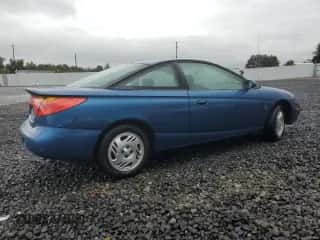 2001 Saturn SC with VIN 1G8ZR12791Z118164, listed as a Copart auction lot 74393904 with 158,308 mi miles and Salvage title. Bid and sale history available at DreamBid. Image 3.