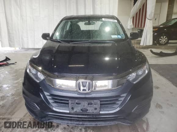 2019 Honda HR-V LX z VIN 3CZRU6H32KG702195, wystawiony jako Copart lot #82227745 z przebiegiem 143 051 mil mil oraz Szkoda całkowita • Salvage title. Historia ofert i sprzedaży dostępna na DreamBid. Obrazek 5.
