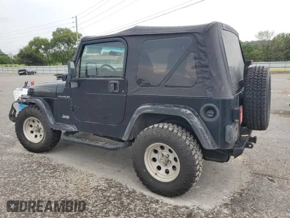 2001 Jeep Wrangler SE with VIN 1J4FA29P41P328835, listed as a Copart auction lot 68713745 with 274,578 mi miles and Clean title. Bid and sale history available at DreamBid. Image 2.
