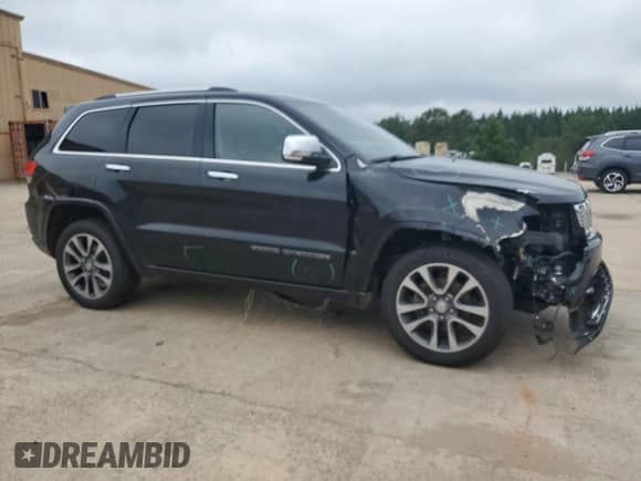 2017 Jeep Grand Cherokee Overland with VIN 1C4RJFCG8HC940430, listed as a Copart auction lot 68780995 with 150,371 mi miles and Salvage title. Bid and sale history available at DreamBid. Image 4.