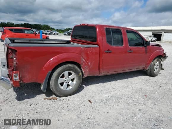2009 Nissan Frontier SE with VIN 1N6AD09W49C404296, listed as a Copart auction lot 61040855 with 144,321 mi miles and Salvage title. Bid and sale history available at DreamBid. Image 3.