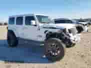 2021 Jeep Wrangler Unlimited Sahara with VIN 1C4HJXENXMW509657, listed as a Copart auction lot 90916025 with 87,621 mi miles and Salvage title. Bid and sale history available at DreamBid. Image 5.