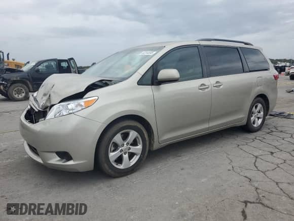 2015 Toyota Sienna LE with VIN 5TDKK3DC1FS629121, listed as a Copart auction lot 82244595 with 80,306 mi miles and Salvage title. Bid and sale history available at DreamBid. Image 1.