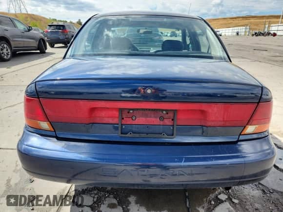 1997 Saturn SL with VIN 1G8ZK5271VZ288861, listed as a Copart auction lot 80120265 with 260,488 mi miles and Salvage title. Bid and sale history available at DreamBid. Image 6.