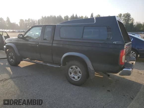 1998 Nissan Frontier XE z VIN 1N6DD26YXWC327296, wystawiony jako Copart lot #83938795 z przebiegiem 240 218 mil mil oraz Czysty tytuł • Clean title. Historia ofert i sprzedaży dostępna na DreamBid. Obrazek 2.