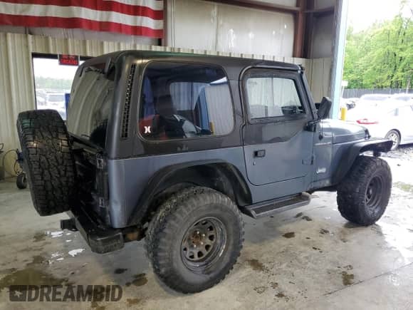 2001 Jeep Wrangler SE with VIN 1J4FA29P11P358326, listed as a Copart auction lot 56181715 with 201,929 mi miles and Clean title. Bid and sale history available at DreamBid. Image 3.