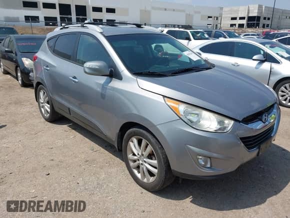 2013 Hyundai Tucson Limited with VIN KM8JU3AC0DU574384, listed as a IAAI auction lot 42901290 with 137,836 mi miles and . Bid and sale history available at DreamBid. Image 1.