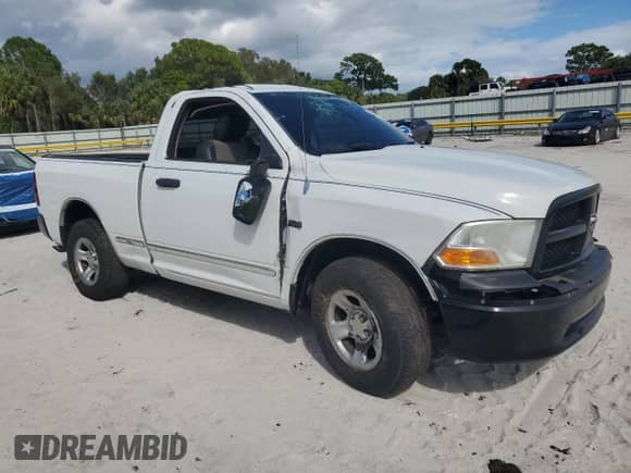 2012 Ram 1500 Tradesman with VIN 3C6JD6AT0CG124510, listed as a Copart auction lot 82440575 with 146,407 mi miles and Salvage title. Bid and sale history available at DreamBid. Image 4.