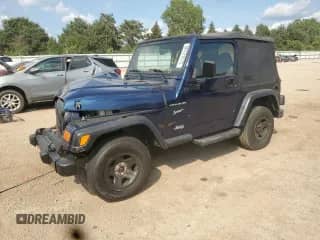 2002 Jeep Wrangler Sport z VIN 1J4FA49S92P766462, wystawiony jako Copart lot #66721075 z przebiegiem 124 822 mil mil oraz Szkoda całkowita • Salvage title. Historia ofert i sprzedaży dostępna na DreamBid. Obrazek 1.