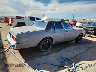 1983 Chevrolet Caprice с VIN 1G1AN69H6DX155174, выставлен на аукционе Copart как лот 80213775 с пробегом 19 781 миль миль и Списание • Salvage title. История ставок и продаж доступна на DreamBid. Изображение 3.