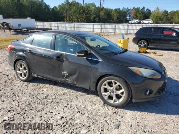 2014 Ford Focus Titanium with VIN 1FADP3J25EL379233, listed as a Copart auction lot 87100875 with 128,688 mi miles and Salvage title. Bid and sale history available at DreamBid. Image 4.