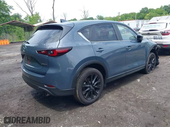 2023 Mazda CX-5 S Carbon Edition z VIN JM3KFBCM8P0223695, wystawiony jako IAAI lot #42379352 z przebiegiem 41 849 mil mil oraz . Historia ofert i sprzedaży dostępna na DreamBid. Obrazek 4.