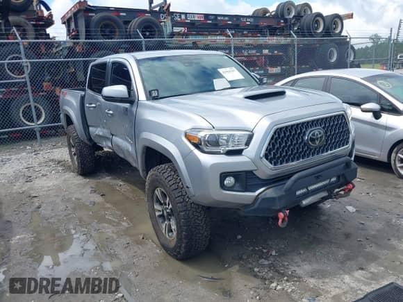 2019 Toyota Tacoma SR z VIN 3TMCZ5AN8KM287646, wystawiony jako IAAI lot #42969397 z przebiegiem 100 562 mil mil oraz . Historia ofert i sprzedaży dostępna na DreamBid. Obrazek 1.
