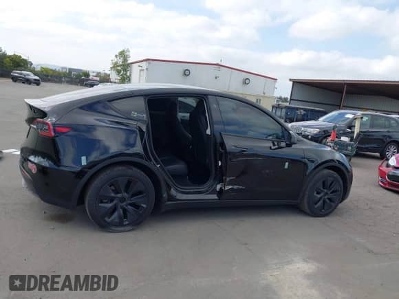 2024 Tesla Model Y with VIN 7SAYGDED8RF156984, listed as a IAAI auction lot 43324819 with 26,941 mi miles and . Bid and sale history available at DreamBid. Image 13.