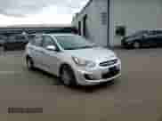 2012 Hyundai Accent GLS z VIN KMHCT4AE4CU040774, wystawiony jako Copart lot #87379495 z przebiegiem 114 351 mil mil oraz Szkoda całkowita • Salvage title. Historia ofert i sprzedaży dostępna na DreamBid. Obrazek 13.
