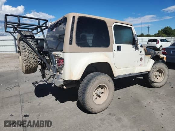 1999 Jeep Wrangler Sahara с VIN 1J4FY49S4XP411704, выставлен на аукционе Copart как лот 71826235 с пробегом Не указан миль и Списание • Salvage title. История ставок и продаж доступна на DreamBid. Изображение 3.