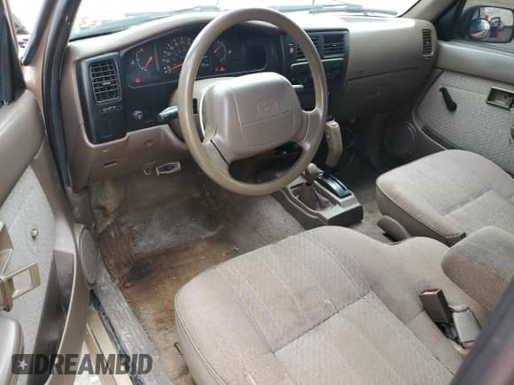 1997 Toyota Tacoma z VIN 4TAWM72N1VZ279828, wystawiony jako Copart lot #58385785 z przebiegiem 347 448 mil mil oraz Szkoda całkowita • Salvage title. Historia ofert i sprzedaży dostępna na DreamBid. Obrazek 8.