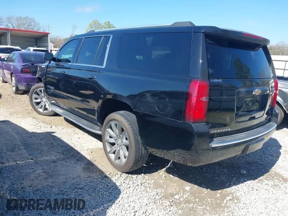 2019 Chevrolet Suburban Premier with VIN 1GNSCJKC5KR360318, listed as a IAAI auction lot 41504344 with 82,997 mi miles and . Bid and sale history available at DreamBid. Image 3.