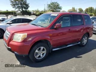 2006 Honda Pilot EX-L with VIN 2HKYF18756H522143, listed as a Copart auction lot 64215205 with 167,516 mi miles and Salvage title. Bid and sale history available at DreamBid. Image 1.