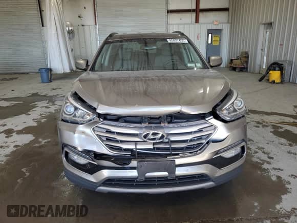2017 Hyundai Santa Fe 2.4L z VIN 5NMZUDLB0HH012693, wystawiony jako Copart lot #85827455 z przebiegiem 139 188 mil mil oraz Szkoda całkowita • Salvage title. Historia ofert i sprzedaży dostępna na DreamBid. Obrazek 5.