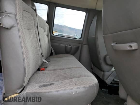 2012 Chevrolet Express Passenger 1LT с VIN 1GAZG1FA7C1169951, выставлен на аукционе Copart как лот 66708485 с пробегом Не указан миль и Списание • Salvage title. История ставок и продаж доступна на DreamBid. Изображение 11.