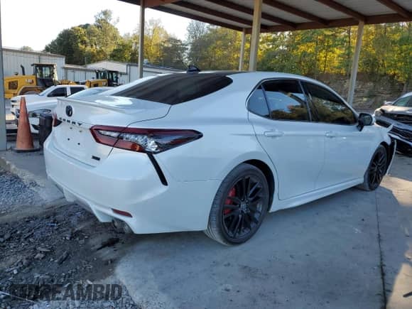 2023 Toyota Camry XSE with VIN 4T1K61AK3PU752318, listed as a Copart auction lot 82528645 with 58,635 mi miles and Salvage title. Bid and sale history available at DreamBid. Image 3.