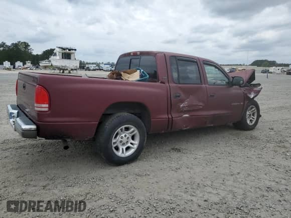 2001 Dodge Dakota Sport with VIN 1B7GL2AX01S140620, listed as a Copart auction lot 51509765 with 230,213 mi miles and Salvage title. Bid and sale history available at DreamBid. Image 3.