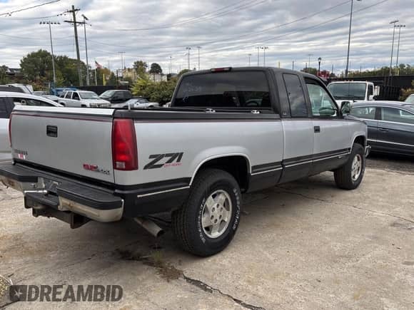 1994 GMC Sierra 1500 with VIN 2GTEK19K4R1579845, listed as a Copart auction lot 89894485 with 148,811 mi miles and Clean title. Bid and sale history available at DreamBid. Image 4.