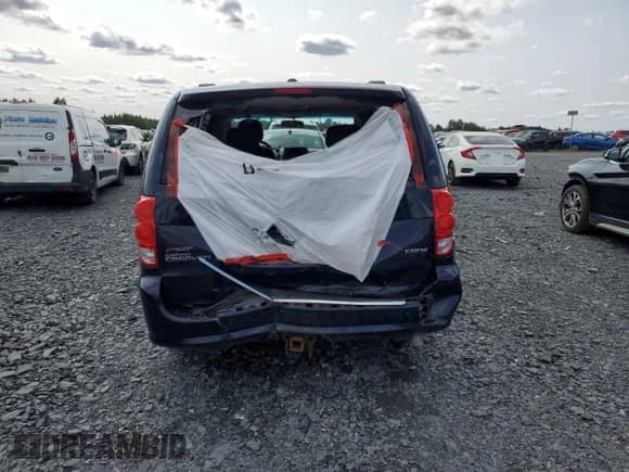 2012 Dodge Grand Caravan Crew with VIN 2C4RDGDG7CR285334, listed as a Copart auction lot 71012185 with Not provided miles and Salvage title. Bid and sale history available at DreamBid. Image 6.
