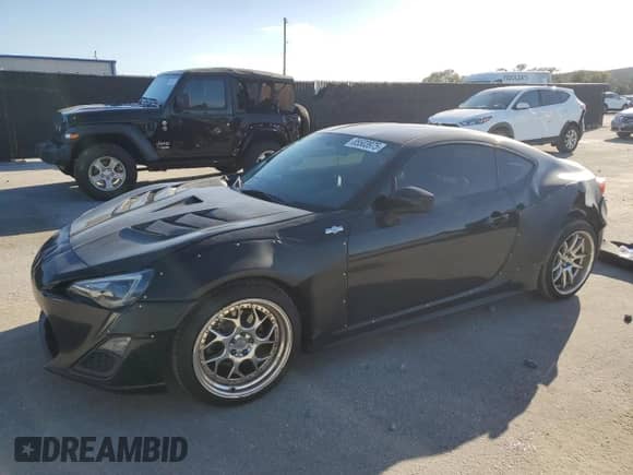 2014 Scion FR-S with VIN JF1ZNAA19E9702042, listed as a Copart auction lot 85503975 with 147,641 mi miles and Salvage title. Bid and sale history available at DreamBid. Image 1.