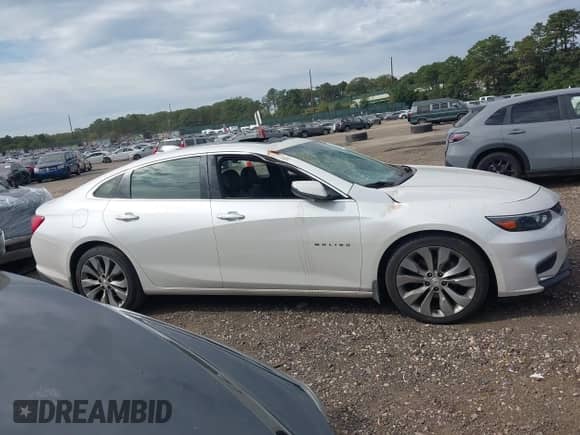 2017 Chevrolet Malibu Premier z VIN 1G1ZH5SX3HF112882, wystawiony jako IAAI lot #43244962 z przebiegiem 79 550 mil mil oraz . Historia ofert i sprzedaży dostępna na DreamBid. Obrazek 13.