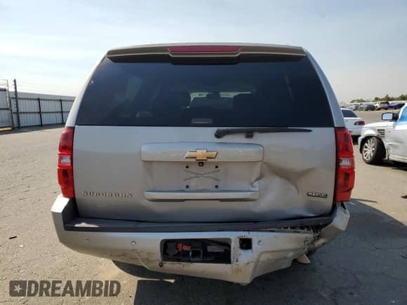 2007 Chevrolet Suburban LS с VIN 1GNFC16027J252200, выставлен на аукционе Copart как лот 70570545 с пробегом 176 306 миль миль и Списание • Salvage title. История ставок и продаж доступна на DreamBid. Изображение 6.