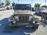 2004 Jeep Wrangler Sahara с VIN 1J4FA59S34P742442, выставлен на аукционе Copart как лот 51053095 с пробегом 161 263 миль миль и Списание • Salvage title. История ставок и продаж доступна на DreamBid. Изображение 5.
