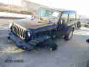 2020 Jeep Wrangler Sport S with VIN 1C4GJXAGXLW228489, listed as a IAAI auction lot 41263174 with 61,400 mi miles and . Bid and sale history available at DreamBid. Image 2.