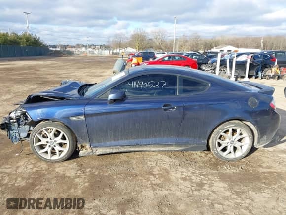 2008 Hyundai Tiburon GT with VIN KMHHN66F88U278938, listed as a IAAI auction lot 41490527 with 200,669 mi miles and . Bid and sale history available at DreamBid. Image 14.